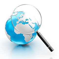 A globe seen through a magnifying glass to represent our search function for searching the content of our GIS training courses